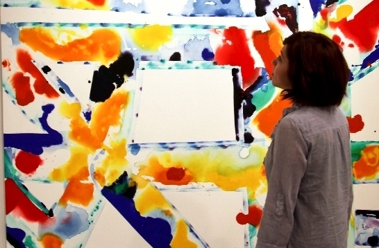 Woman viewing a Sam Francis painting